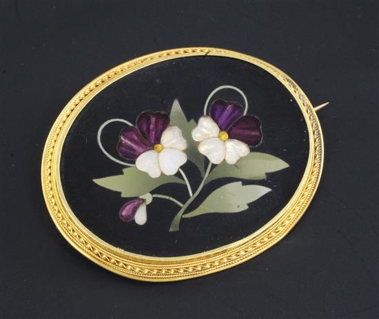 A late 19th/early 20th century Italian gold mounted pietra dura and paste oval brooch, 2in.